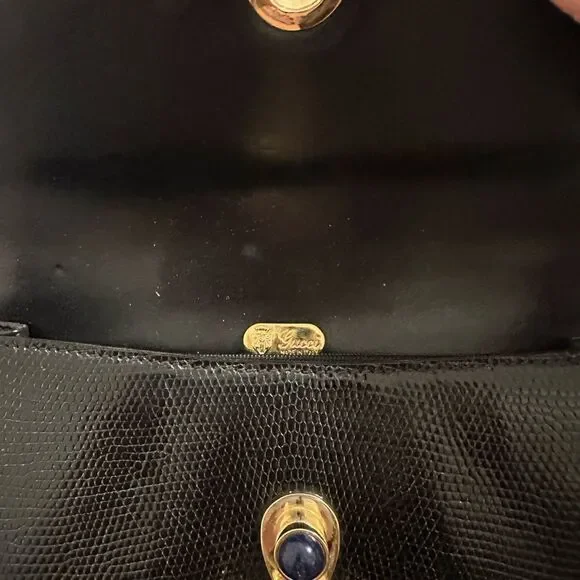 Gucci Black and Gold Leather Clutch